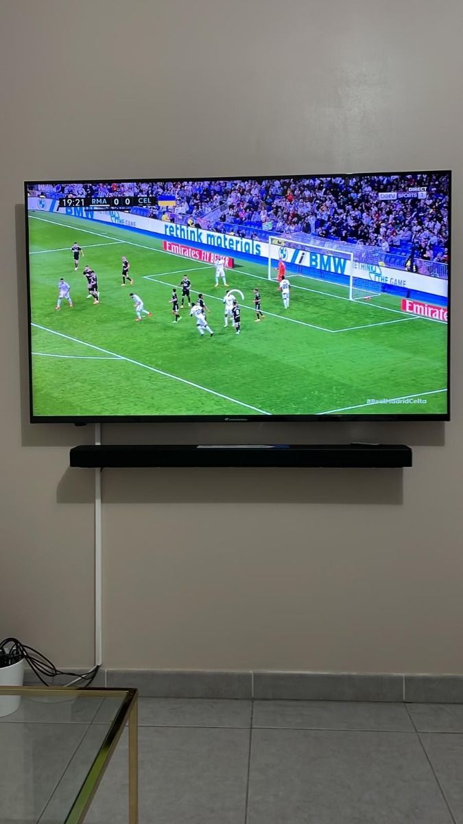 Wide flat screen television showing Clear View IPTV entertainment home menu